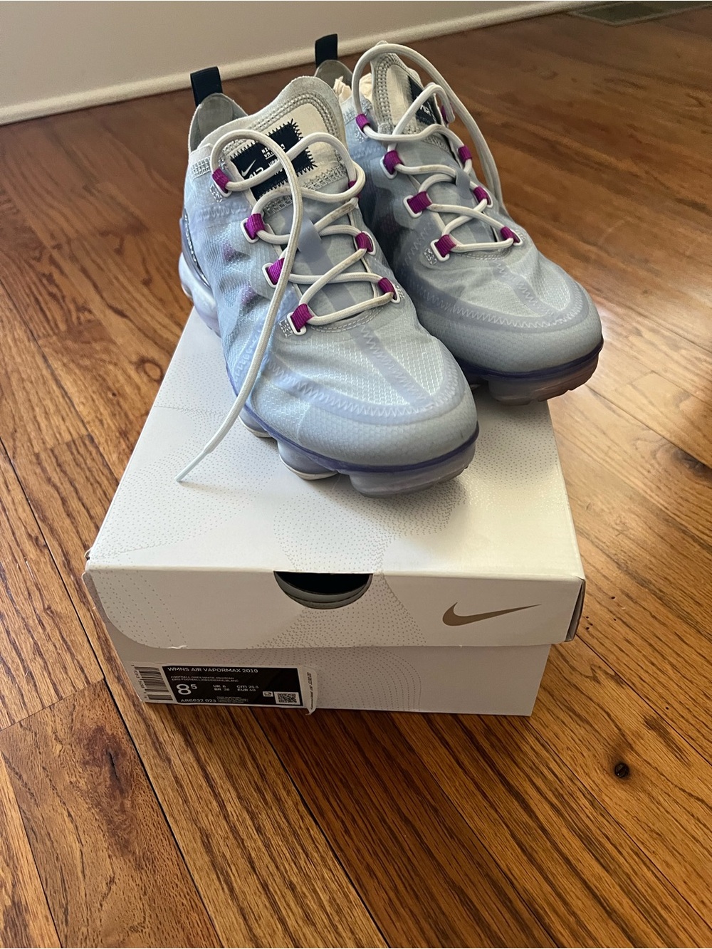 Nike Women’s Light Gray Sneakers with Purple Eyelet Accents
